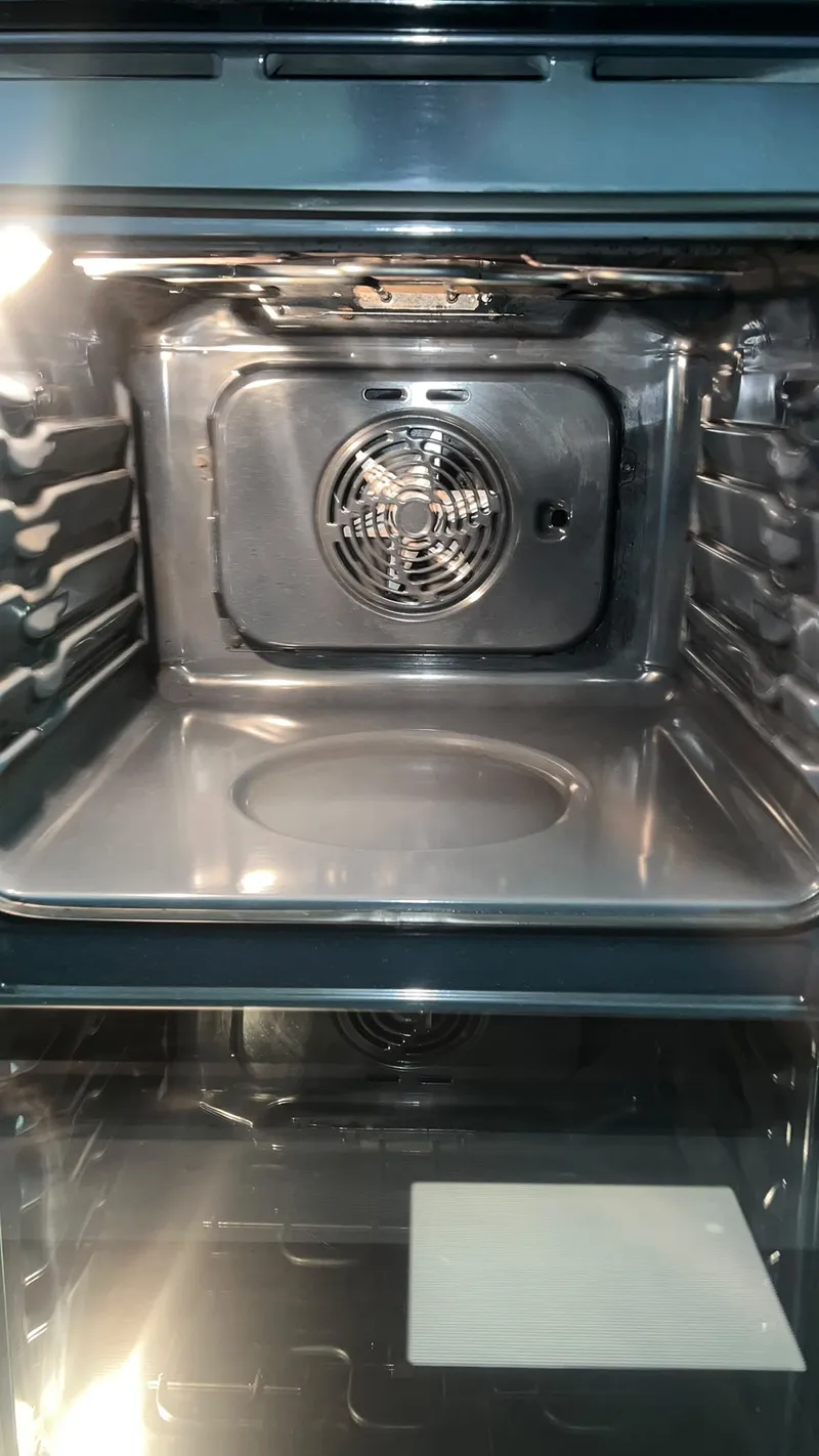 Oven interior and fan cover after cleaning